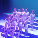 group of girls dressed in dance outfits